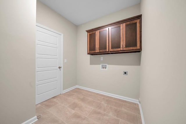 laundry room featuring hookup for a washing machine, hookup for an electric dryer, and cabinets