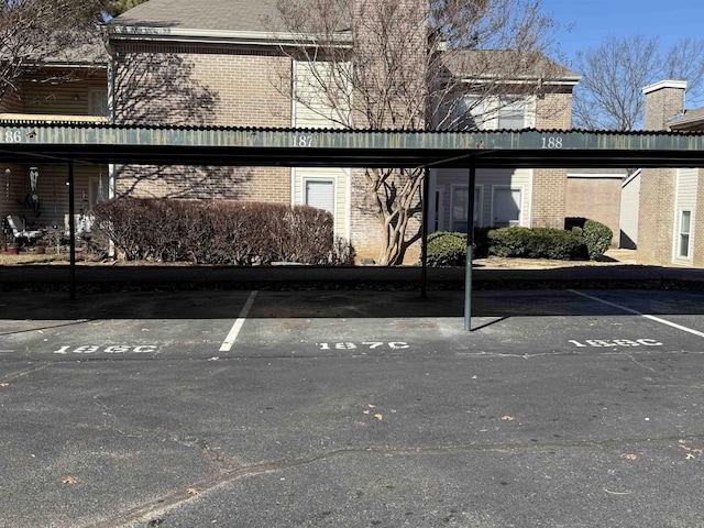 view of vehicle parking with a carport