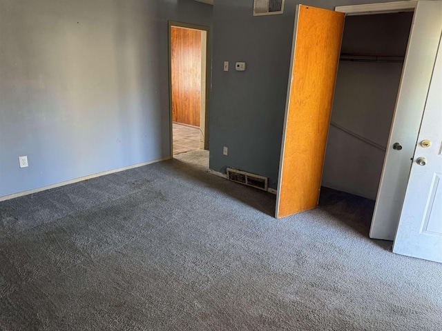 unfurnished bedroom featuring a closet and carpet flooring