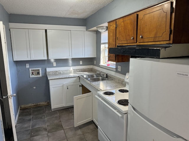 kitchen featuring white appliances, a textured ceiling, white cabinetry, sink, and ventilation hood