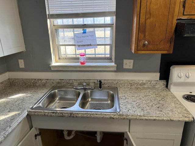 kitchen featuring sink and electric stove