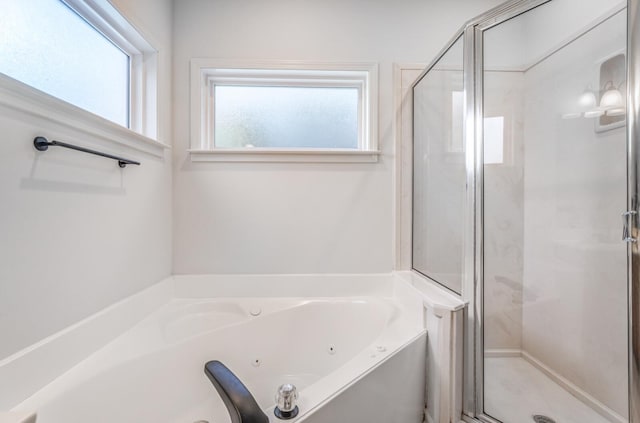 bathroom with plenty of natural light and independent shower and bath