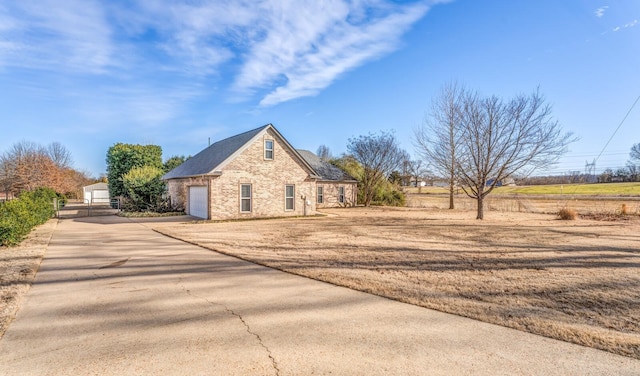 view of side of home featuring a garage