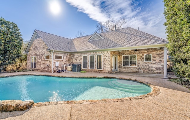 view of pool with cooling unit, a patio area, and ceiling fan