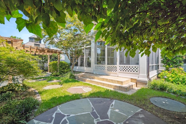 exterior space with a patio area and a sunroom