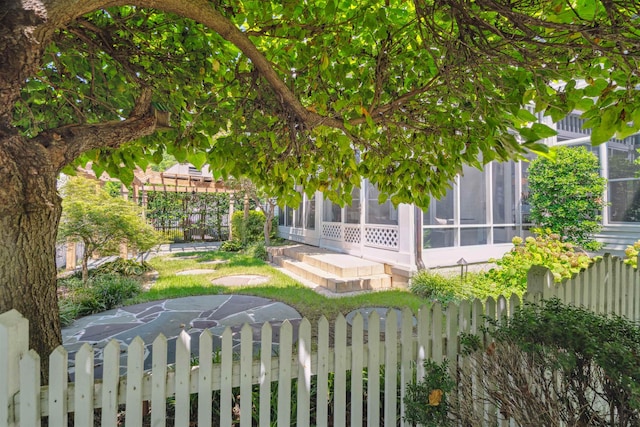 view of yard with a sunroom