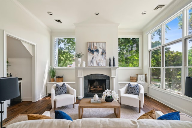 living room featuring dark wood-type flooring and ornamental molding