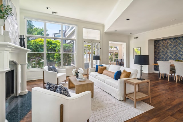 living room featuring hardwood / wood-style flooring and crown molding