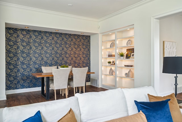 dining room featuring built in features, crown molding, and dark hardwood / wood-style floors