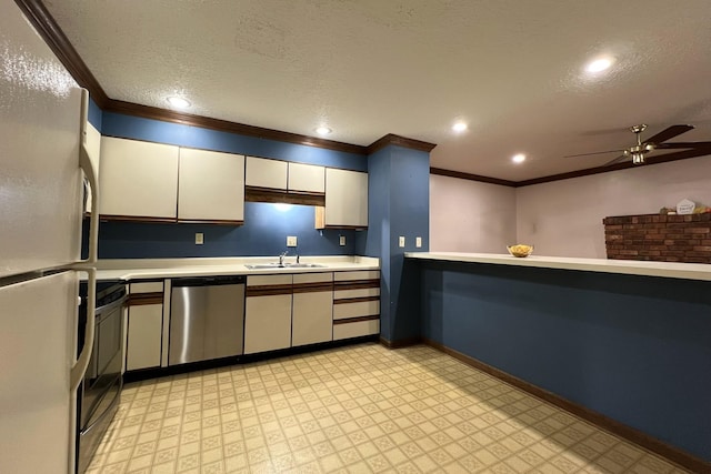 kitchen featuring sink, crown molding, a textured ceiling, and appliances with stainless steel finishes