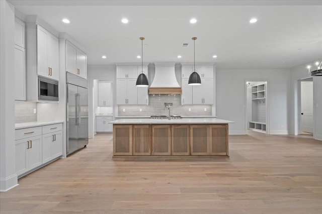 9170 Old Green Ln, Germantown, TN 38138 - kitchen featuring built in appliances, premium range hood, light countertops, backsplash, and recessed lighting