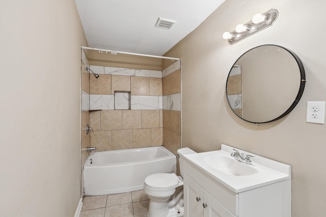 full bathroom featuring tile patterned floors, tiled shower / bath combo, toilet, and vanity