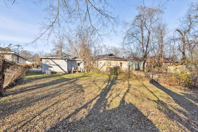 back of house featuring a yard