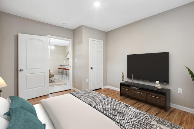 bedroom with hardwood / wood-style flooring