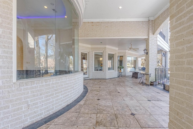 view of patio featuring ceiling fan