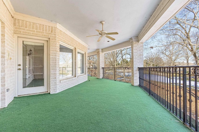 exterior space featuring a balcony and ceiling fan