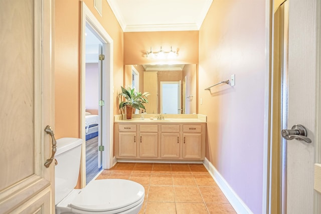 bathroom featuring tile patterned floors, toilet, ornamental molding, and vanity