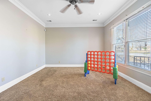 interior space with carpet floors, ornamental molding, and ceiling fan