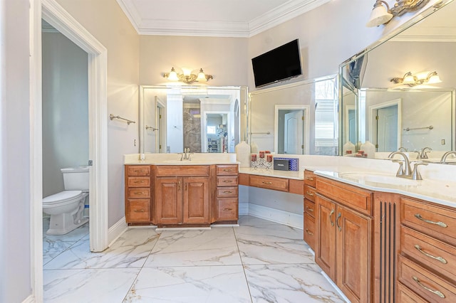 bathroom featuring toilet, vanity, and crown molding