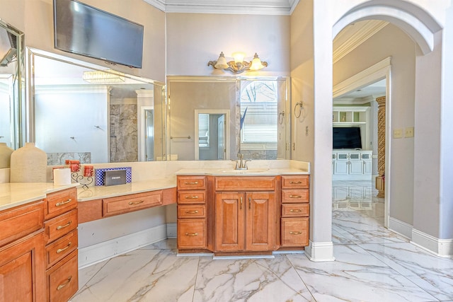 bathroom featuring crown molding and vanity