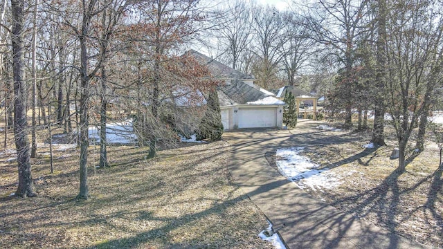 view of side of home featuring a garage