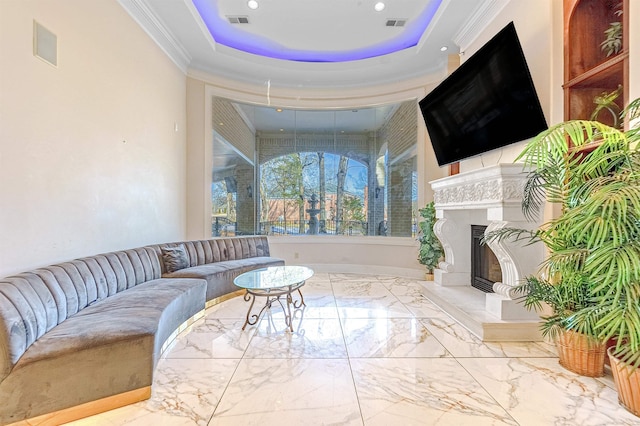 living room featuring a tray ceiling and crown molding