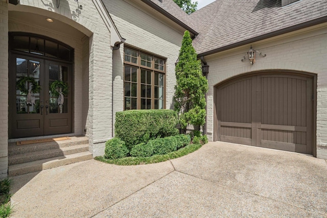 view of exterior entry featuring french doors