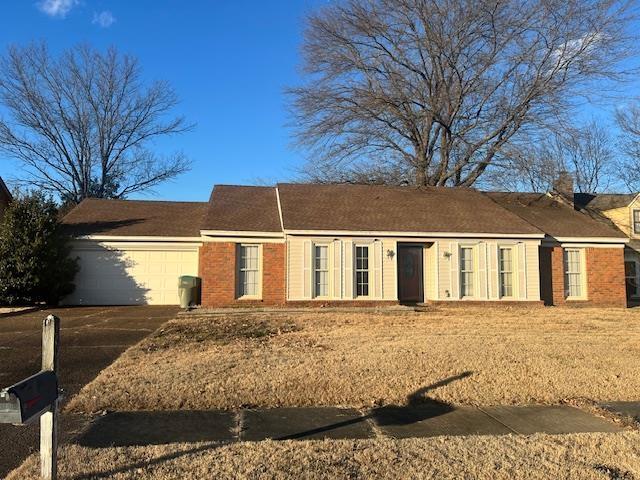 single story home with a garage