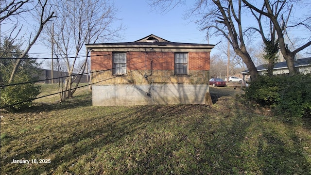 view of property exterior with a yard