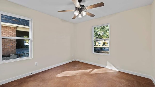 carpeted empty room featuring ceiling fan