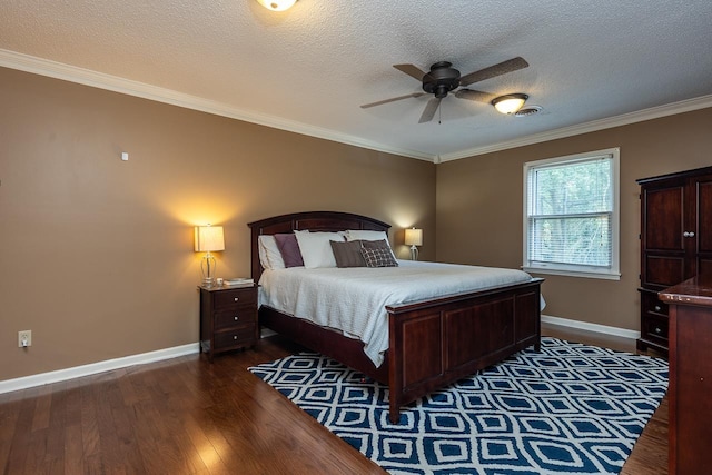 bedroom featuring crown molding, dark wood-type flooring, a textured ceiling, and ceiling fan