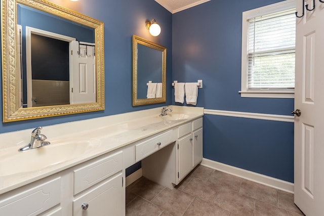 bathroom with vanity, crown molding, and tile patterned floors