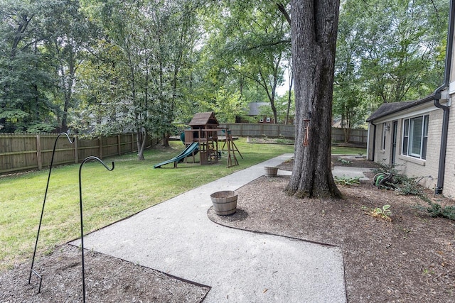 view of yard with a patio and a playground