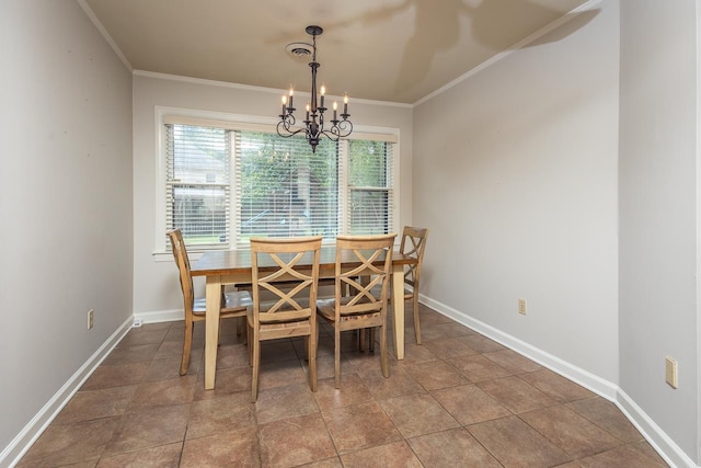 dining area with tile patterned flooring, ornamental molding, and an inviting chandelier