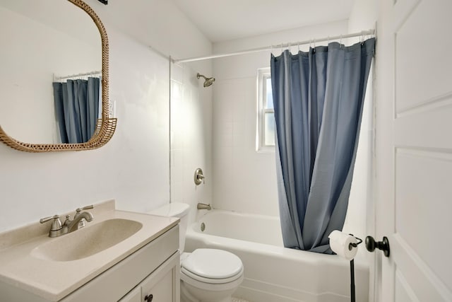 full bathroom featuring toilet, vanity, and shower / bathtub combination with curtain