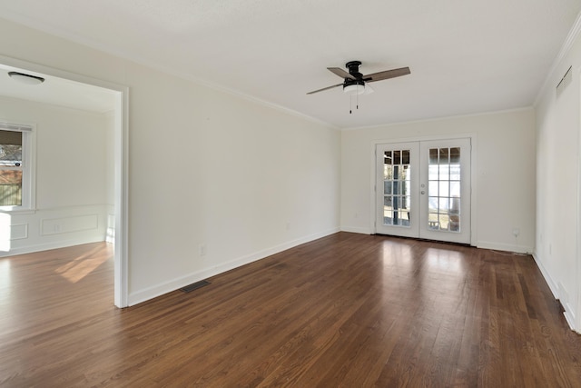 spare room featuring ornamental molding, ceiling fan, dark hardwood / wood-style flooring, and french doors