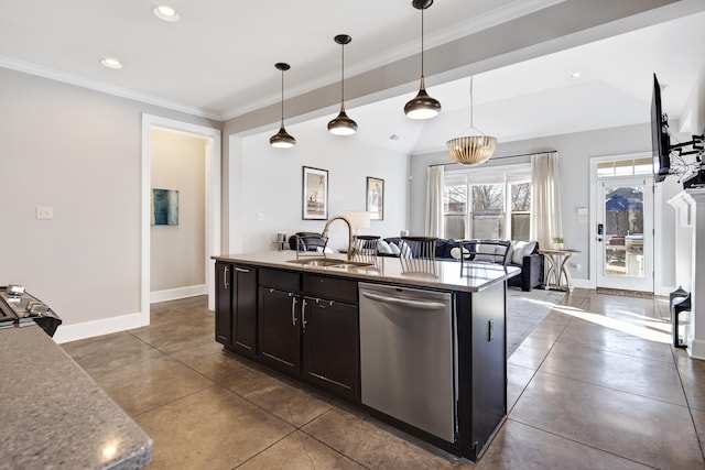 kitchen with sink, light stone counters, decorative light fixtures, a center island with sink, and appliances with stainless steel finishes