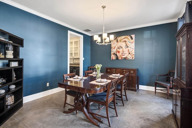 dining room featuring an inviting chandelier, concrete flooring, and ornamental molding