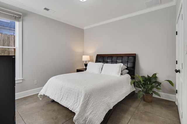 bedroom with crown molding and concrete floors