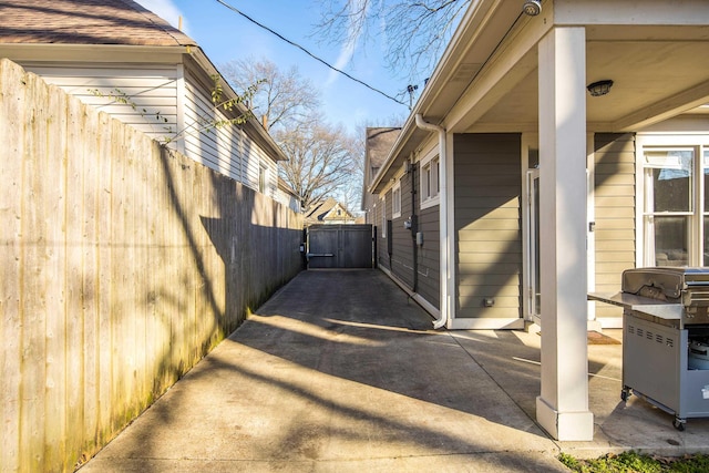 view of side of property with a patio