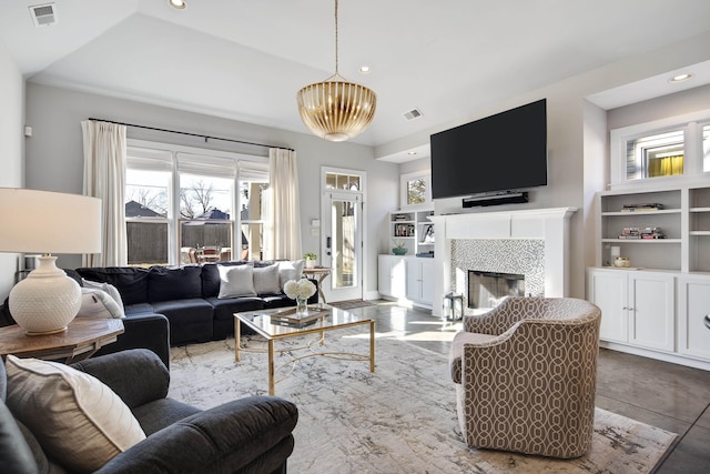 living room with a tiled fireplace