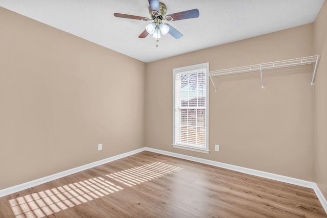 unfurnished room featuring hardwood / wood-style flooring and ceiling fan