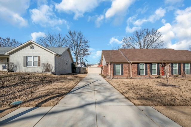 view of side of property featuring an outbuilding and a garage