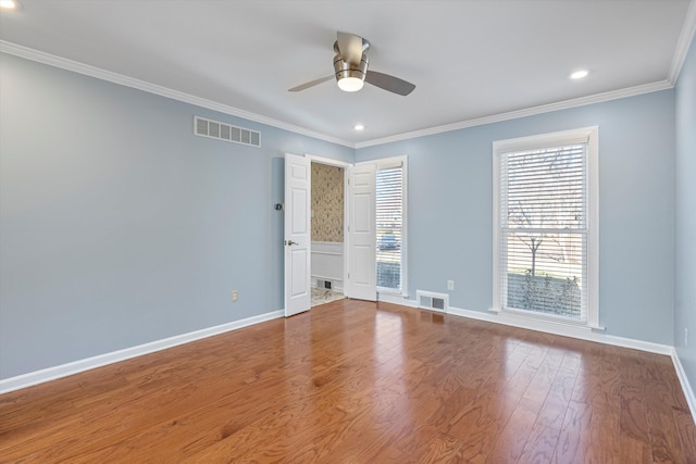 unfurnished room with crown molding, ceiling fan, and hardwood / wood-style flooring