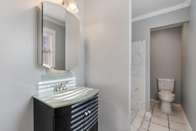 bathroom featuring vanity, ornamental molding, tile patterned floors, and toilet