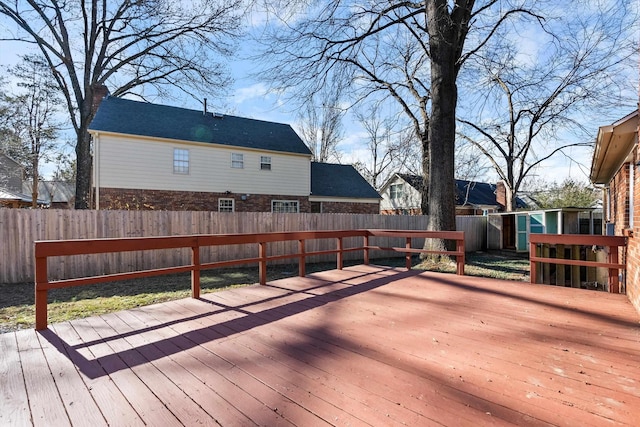 wooden deck with a shed