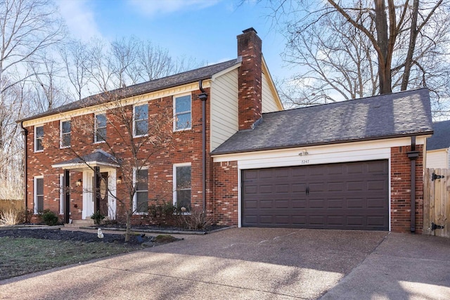 colonial inspired home featuring a garage