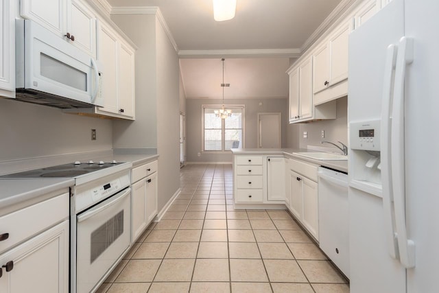 kitchen featuring sink, hanging light fixtures, light tile patterned floors, white appliances, and white cabinets