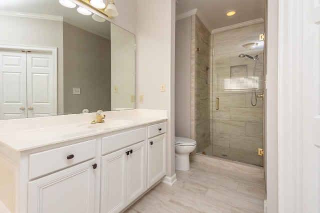 bathroom with vanity, ornamental molding, an enclosed shower, and toilet