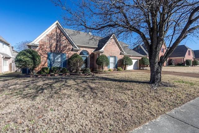 front of property featuring a garage and a front yard